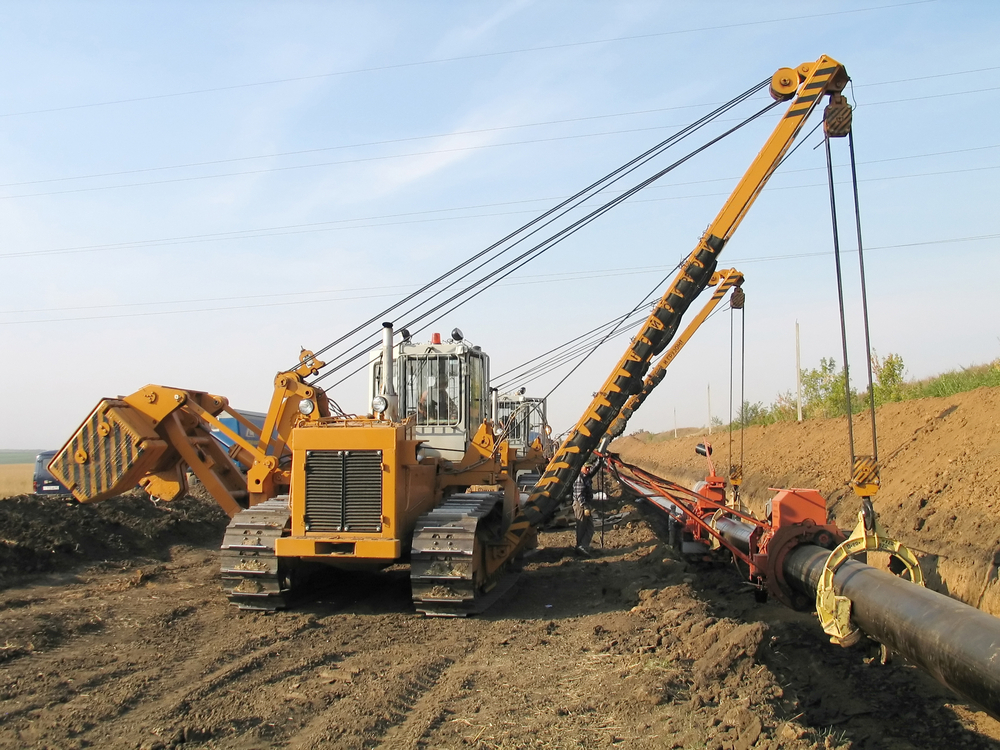 Construction-machinery-laying-pipe.jpg